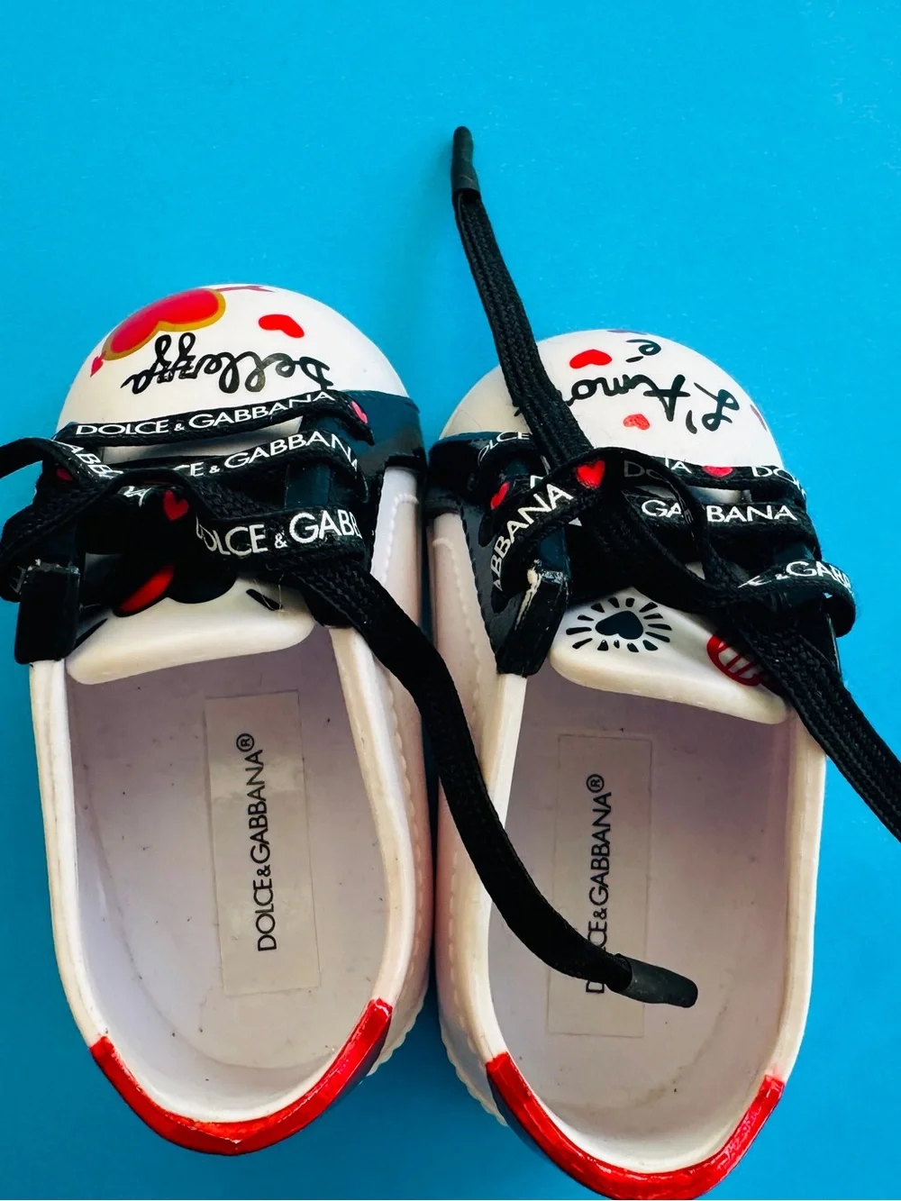 Dolce & Gabbana Doll White Sneakers with Black Laces and Red Heart Accents